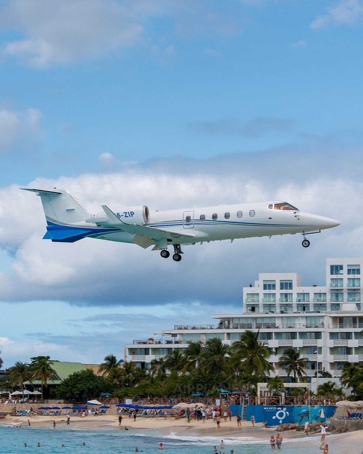 Trans Island Airways Learjet (C6-ZIP) on approach over Maho Beach, Sint Maarten